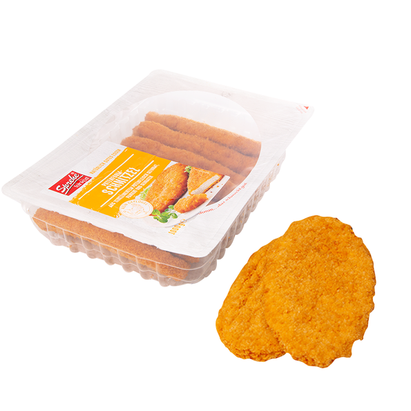 Putenformschnitzel aus zerkleinerten Putenbruststücken zusammengefügt, paniert und gebraten